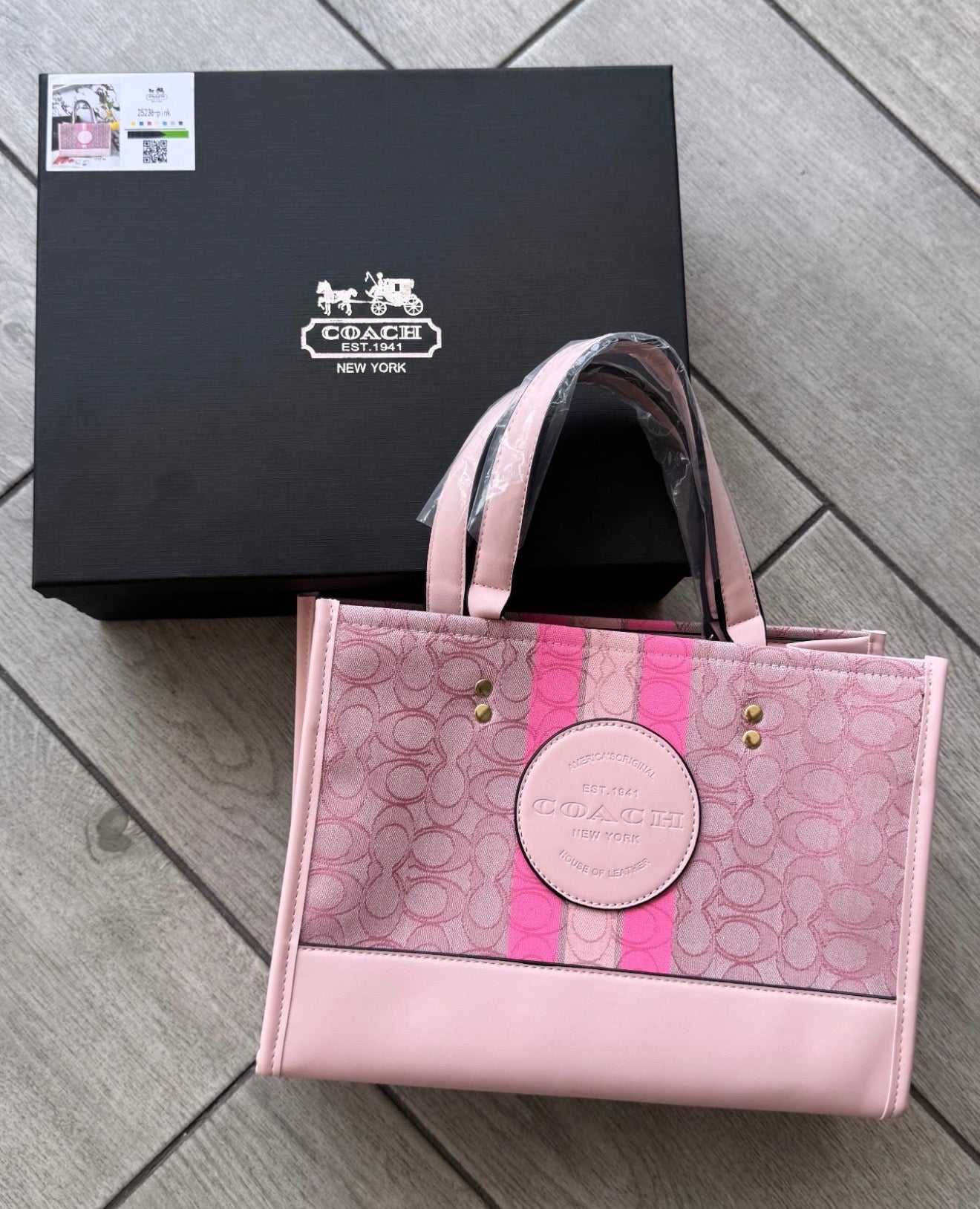 Cartera Coach Dempsey En Jacquard De Firma Rosa Con Caja