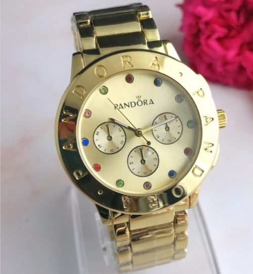 Reloj Pandora dorado con brillos de colores