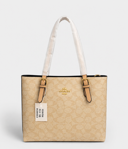 Cartera Coach Tote Mollie 25 de lona con motivo de firma en color Kakhi Con Caja